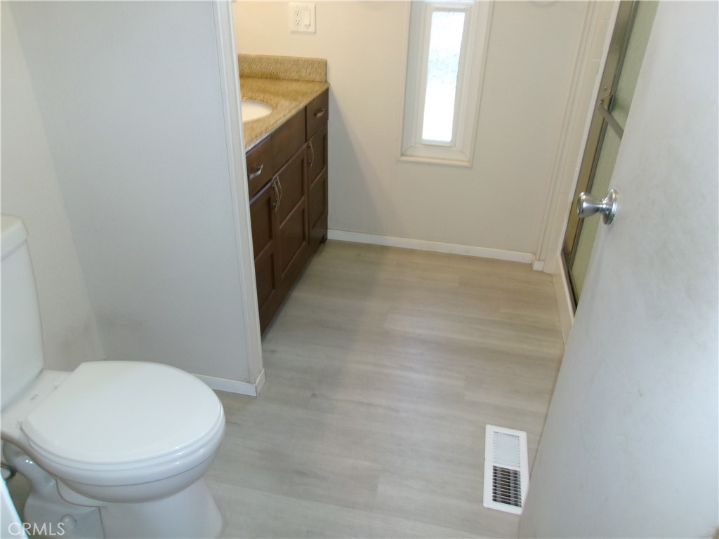 4044 Cherry Hill Road Santa Maria, CA 93455 - Photo 8 of 13 a bathroom with a sink a toilet and a window