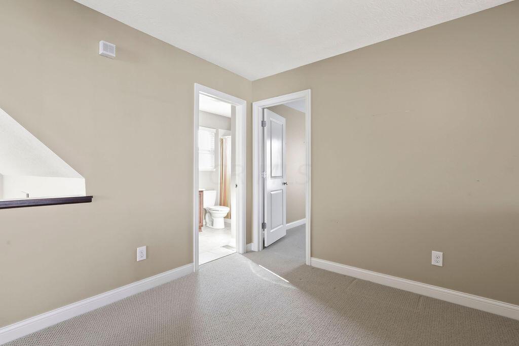 6163 Jennis Road Westerville, OH 43081 - Photo 27 of 44 • Tan carpet
• Tan painted walls
• Lighted ceiling fan
• Linen closet