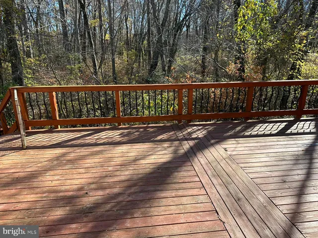 a view of a balcony with wooden floor