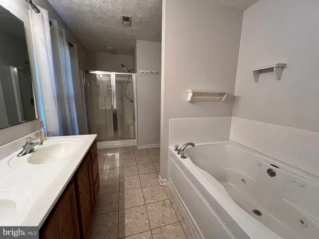 a bathroom with a bathtub and a sink