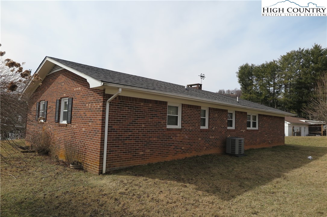 134 Carson Boulevard Sparta, NC 28675 - Photo 14 of 15 a front view of a house with a yard
