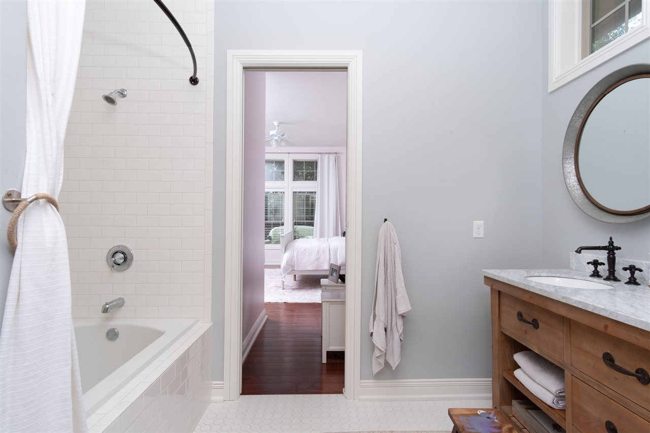 8745 Burr Oak Road Roscoe, IL 61073 - Photo 14 of 20 a bathroom with a sink a toilet and shower