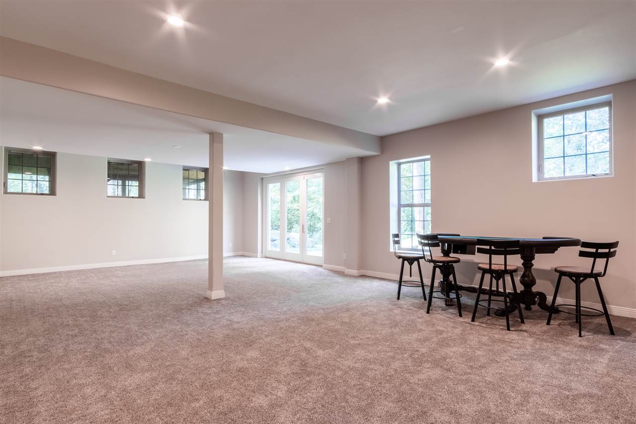 8745 Burr Oak Road Roscoe, IL 61073 - Photo 17 of 20 a view of a livingroom with furniture and a window