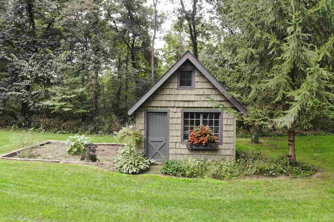 8745 Burr Oak Road Roscoe, IL 61073 - Photo 19 of 20 a front view of a house with a yard