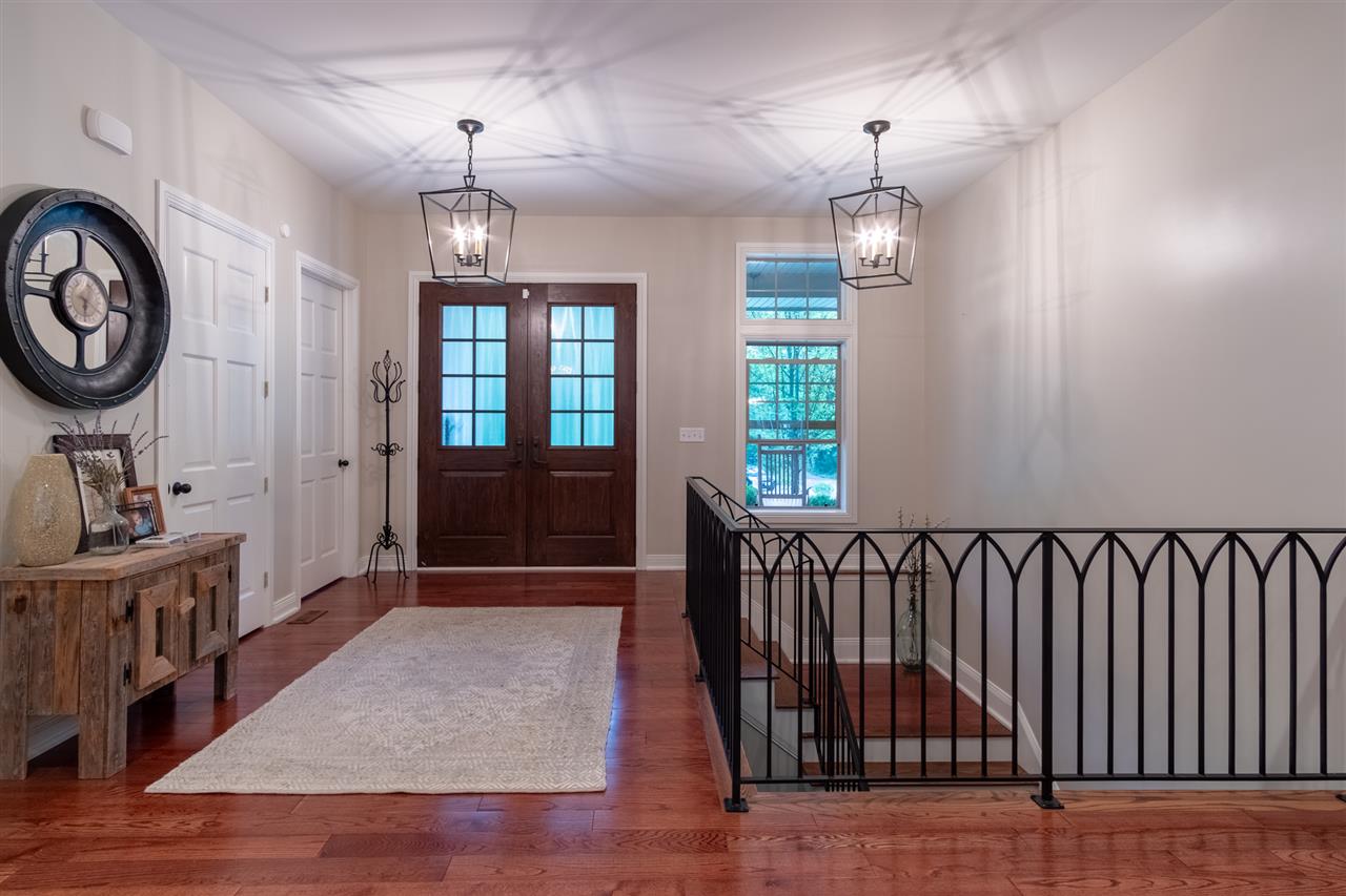 8745 Burr Oak Road Roscoe, IL 61073 - Photo 7 of 20 an entryway with a window and wooden floor