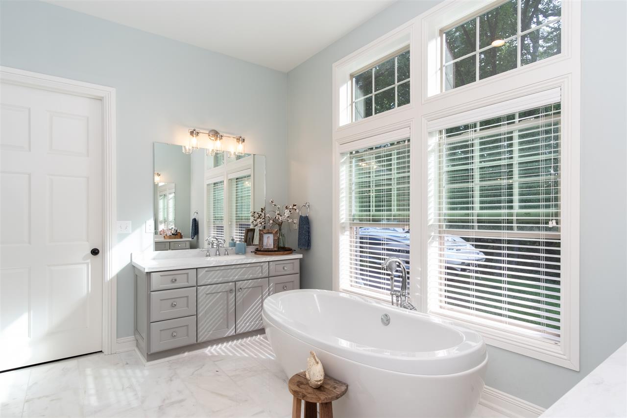 8745 Burr Oak Road Roscoe, IL 61073 - Photo 10 of 20 a bathroom with a sink and a mirror