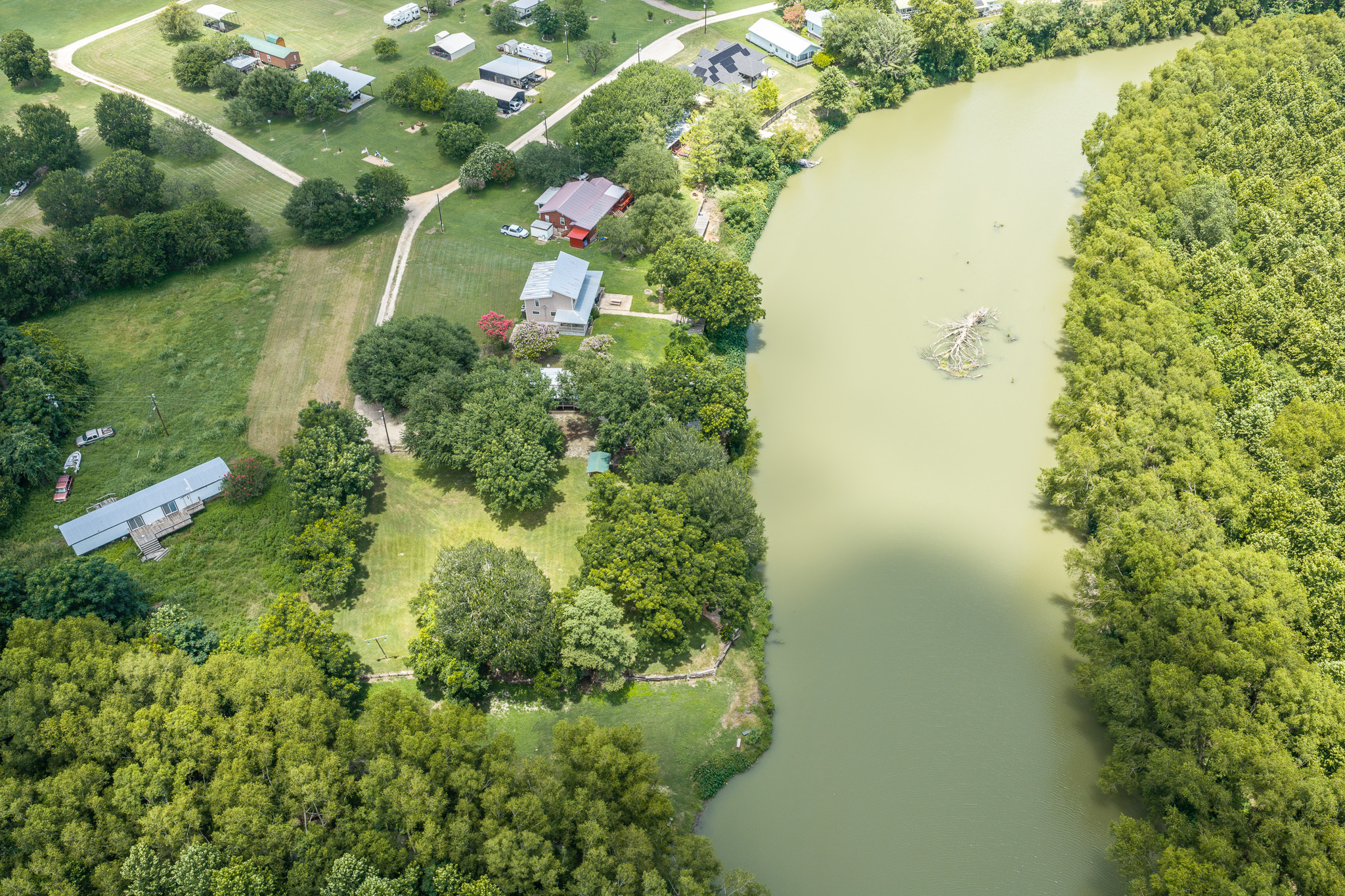Tbd Goodwin Road Gonzales, TX 78629 - Photo 31 of 33 A tranquil river winds through verdant landscape, showcasing waterfront living opportunities.