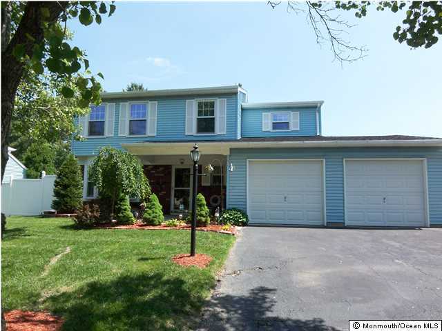 34 Peachstone Road Howell, NJ 07731 - Photo 1 of 3 a front view of a house with a yard