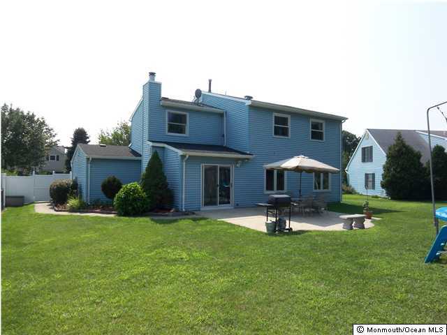 34 Peachstone Road Howell, NJ 07731 - Photo 3 of 3 a swimming pool with outdoor seating and yard