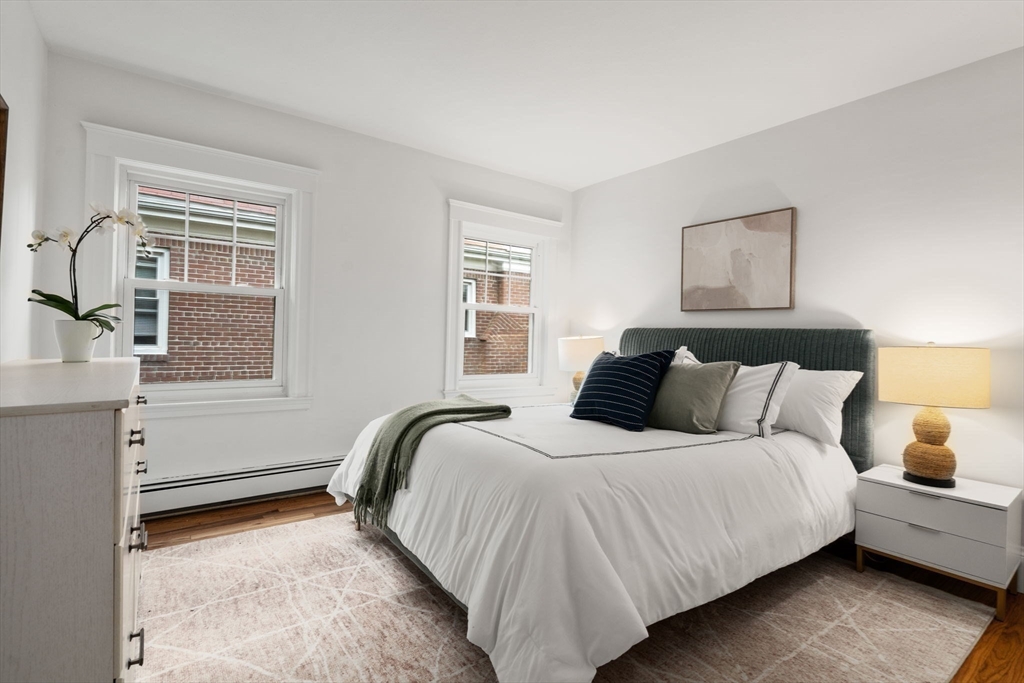 500 Washington Street, Unit 2 Brookline, MA 02445 - Photo 11 of 23 a bedroom with a bed and a window