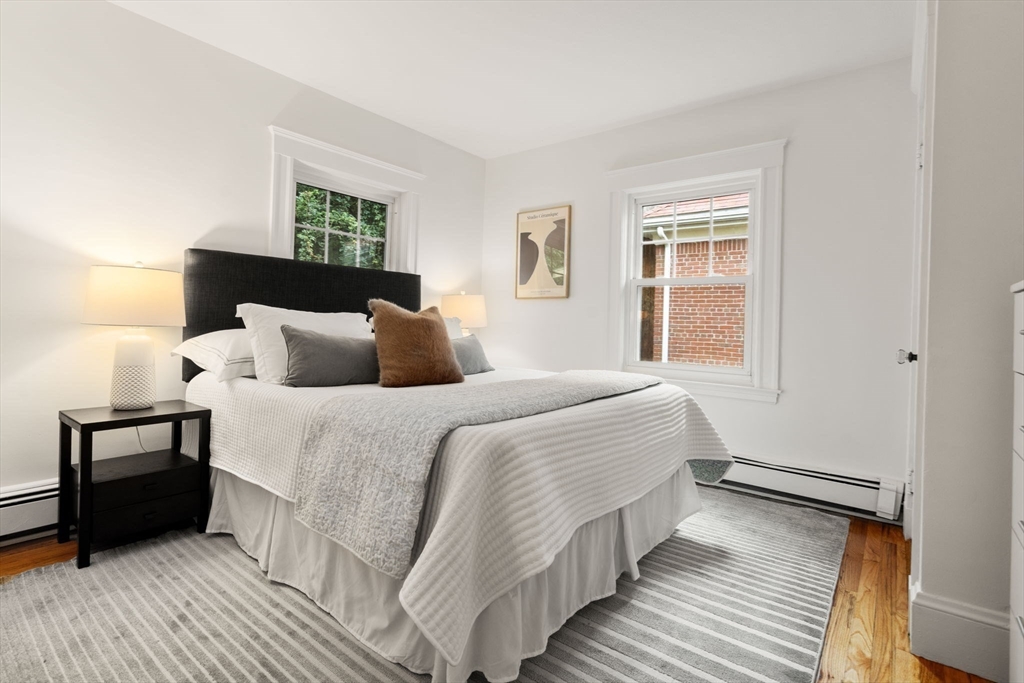 500 Washington Street, Unit 2 Brookline, MA 02445 - Photo 12 of 23 a bedroom with a bed and a night stand