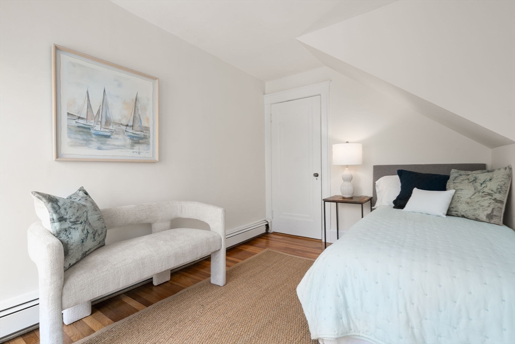 500 Washington Street, Unit 2 Brookline, MA 02445 - Photo 13 of 23 a bedroom with a bed and a couch