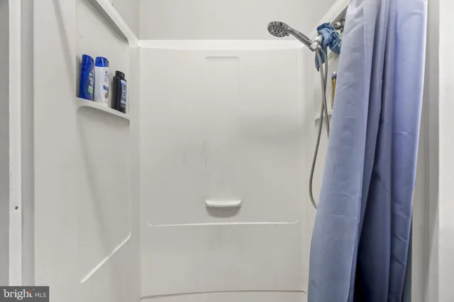 a livingroom with workspace and a window