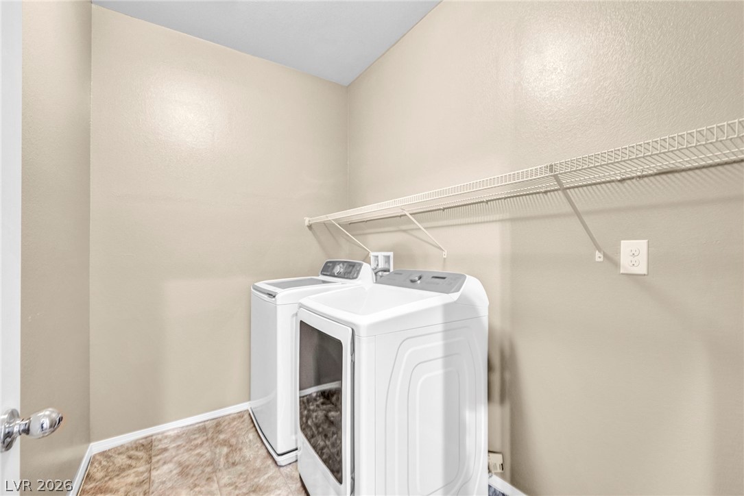 5014 Fiery Sky Ridge Street Las Vegas, NV 89148 - Photo 16 of 21 Conveniently located laundry area with modern appliances and ample storage space.
