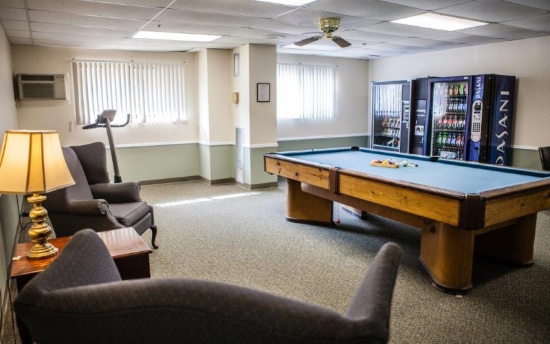 920 John R Road Troy, MI 48083 - Photo 8 of 12 a living room with furniture pool table and a window