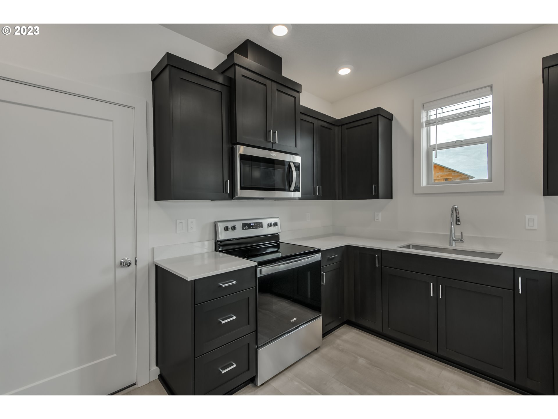 2045 Strong Road Southeast Salem, OR 97302 - Photo 2 of 10 a kitchen with a sink stainless steel appliances and cabinets