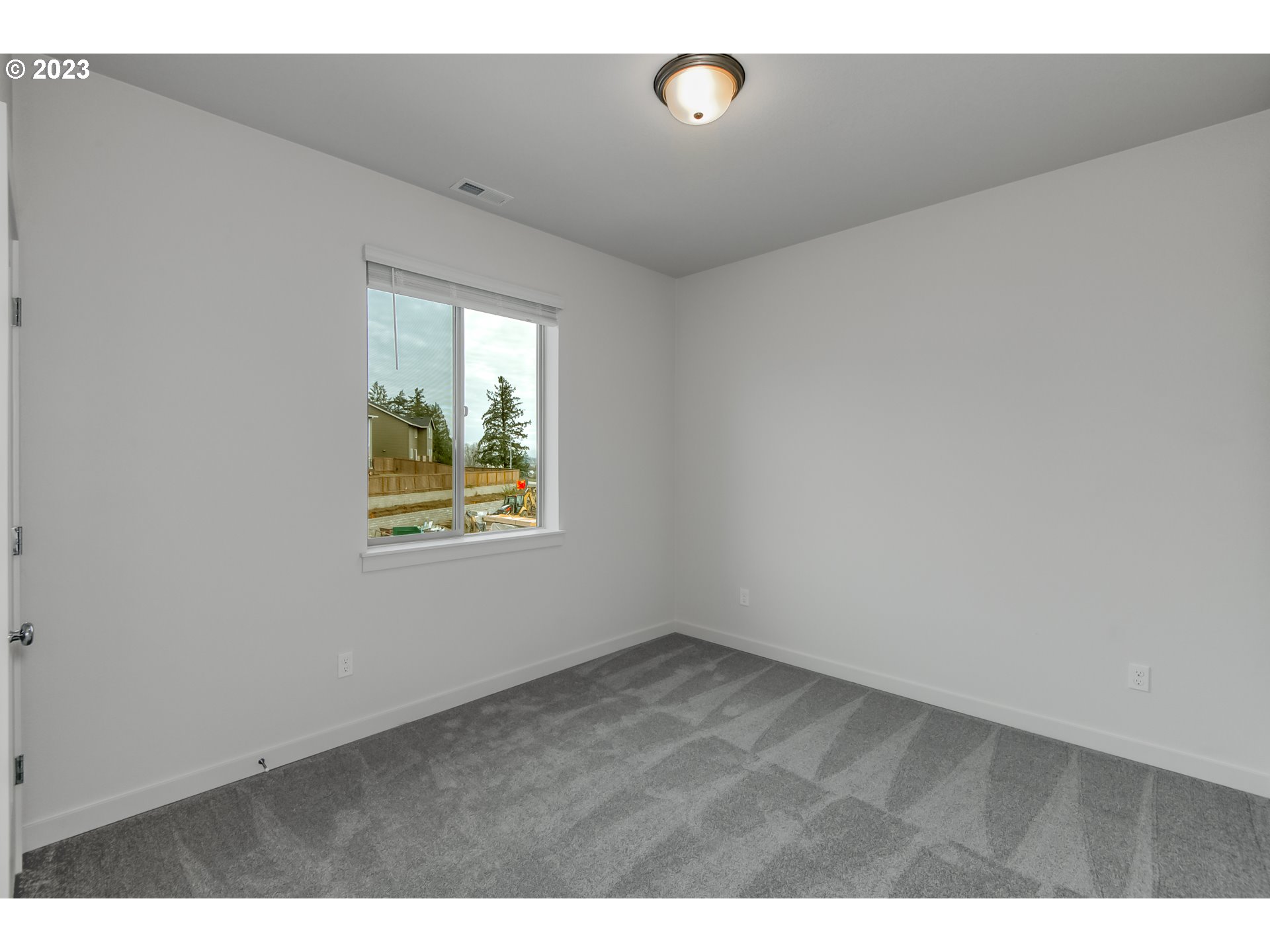 2045 Strong Road Southeast Salem, OR 97302 - Photo 5 of 10 a view of an empty room with a window