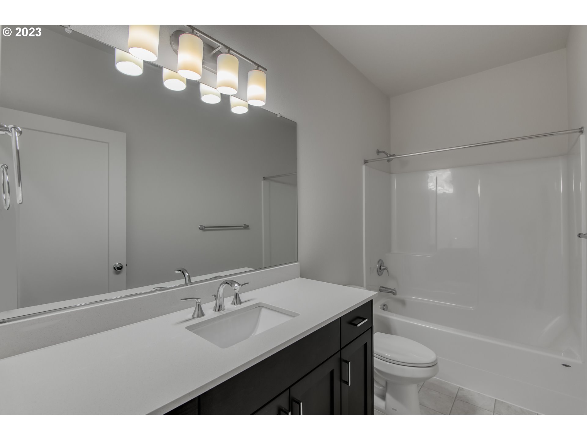 2045 Strong Road Southeast Salem, OR 97302 - Photo 7 of 10 a bathroom with a sink a toilet a shower and a mirror