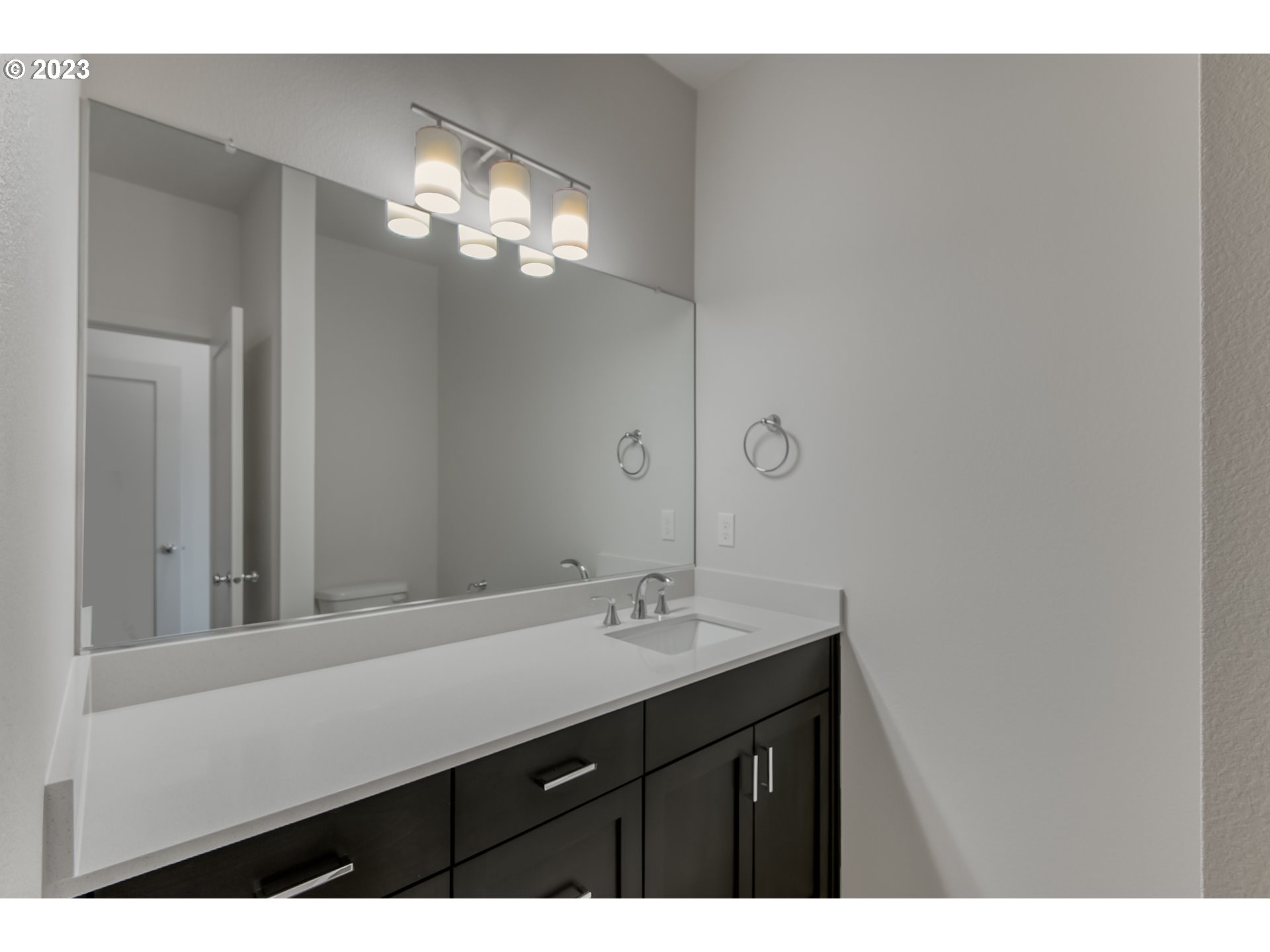 2045 Strong Road Southeast Salem, OR 97302 - Photo 10 of 10 a bathroom with a sink and a mirror