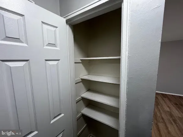 a storage room with wooden floor
