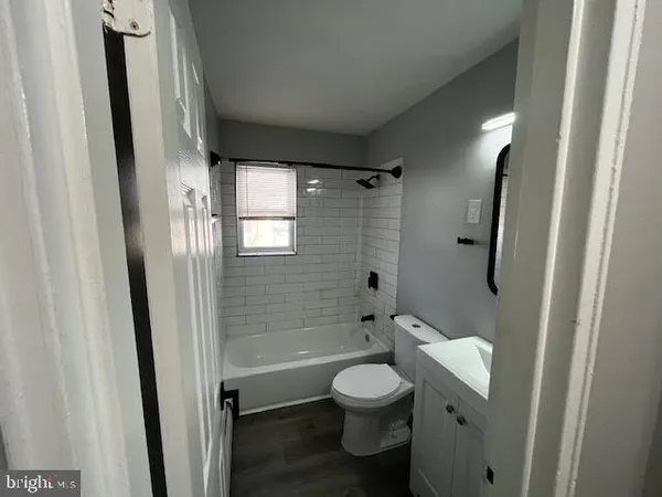 a bathroom with a toilet a sink and shower