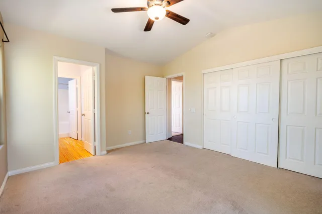 a view of empty room with ceiling fan