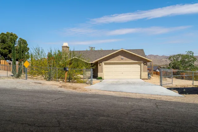 a view of a house with a street