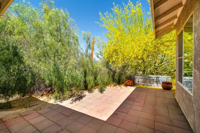 a view of a patio and fire pit