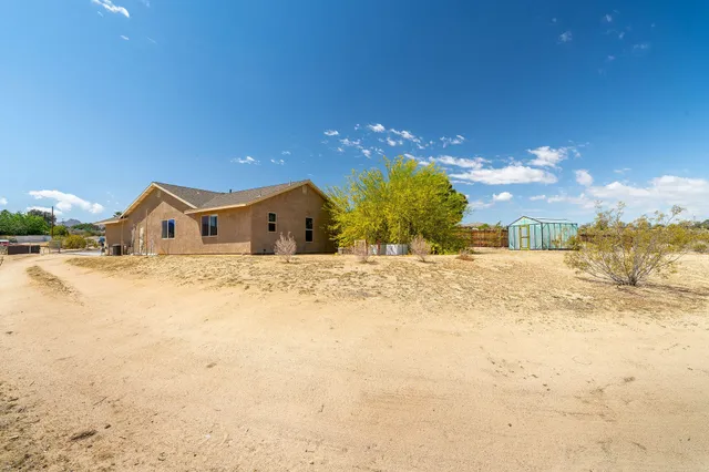 a view of potted plants in front of house