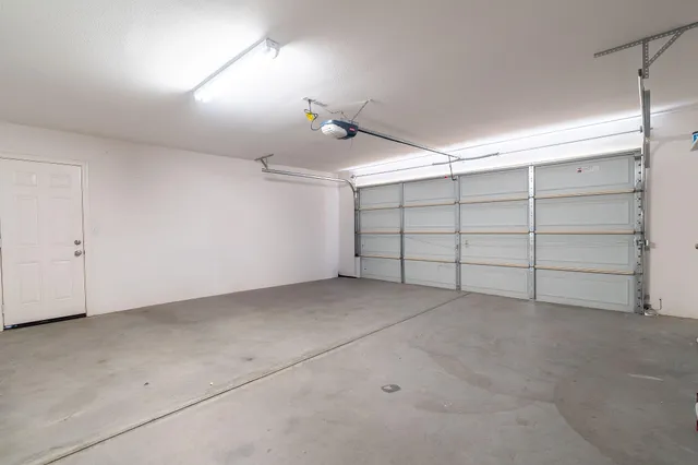 an aerial view of residential building and parking space