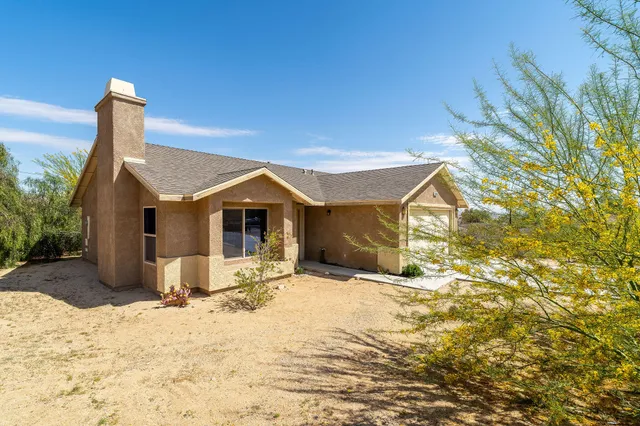 a view of a house with a snow in the yard