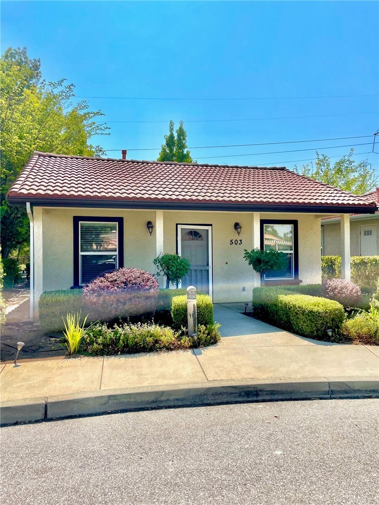 503 North Ferrocarril Road, Unit 2 Atascadero, CA 93422 - Photo 1 of 1 a front view of a house with a garden and outdoor seating