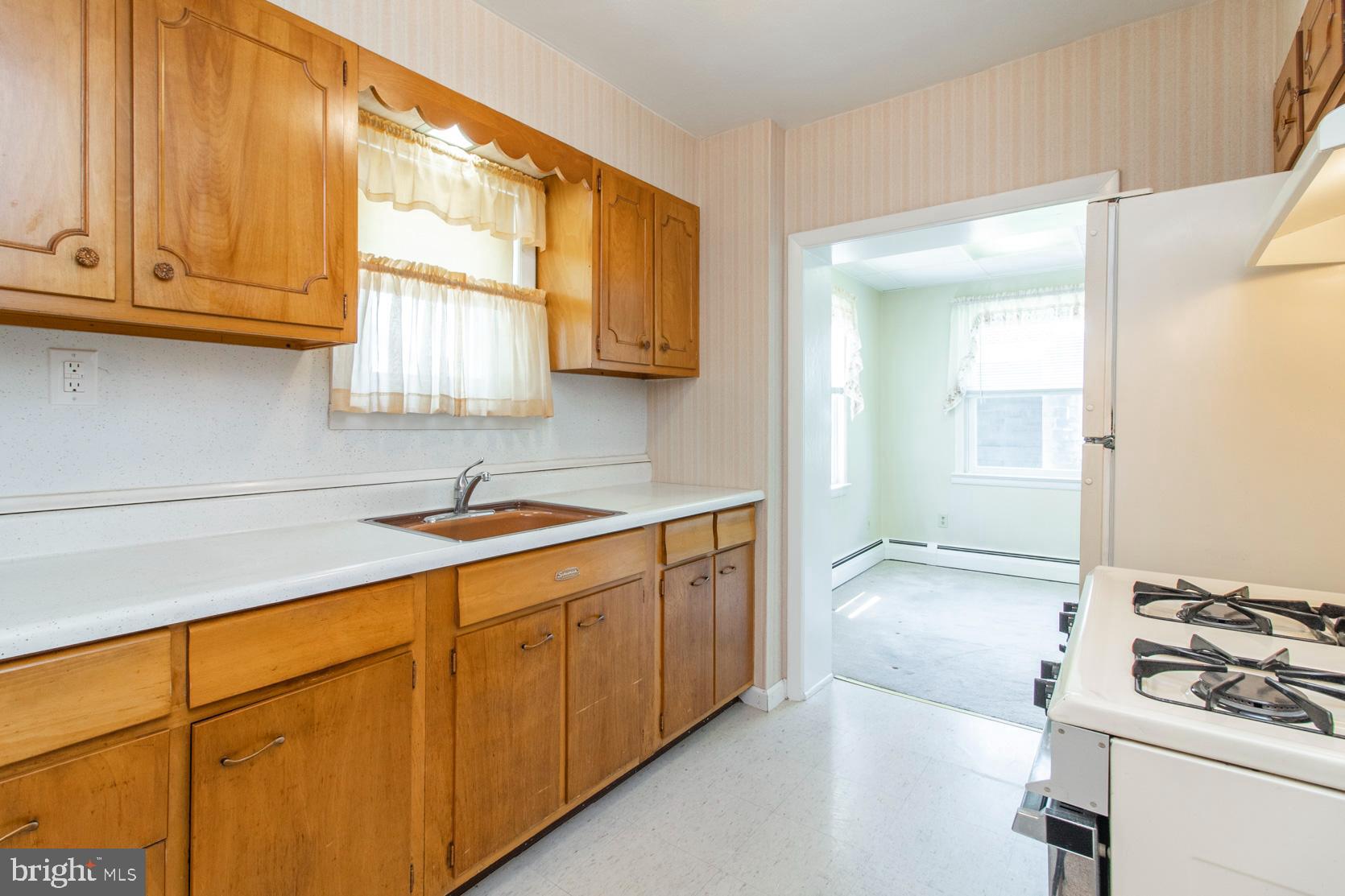 124 Woodbine Road Havertown, PA 19083 - Photo 14 of 26 a kitchen with stainless steel appliances granite countertop a sink and a stove