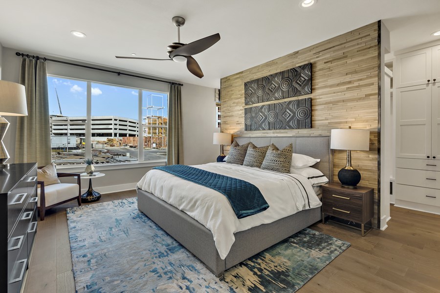 4206 Endurance Way Austin, TX 78731 - Photo 15 of 28 a bedroom with a bed a couch and large window