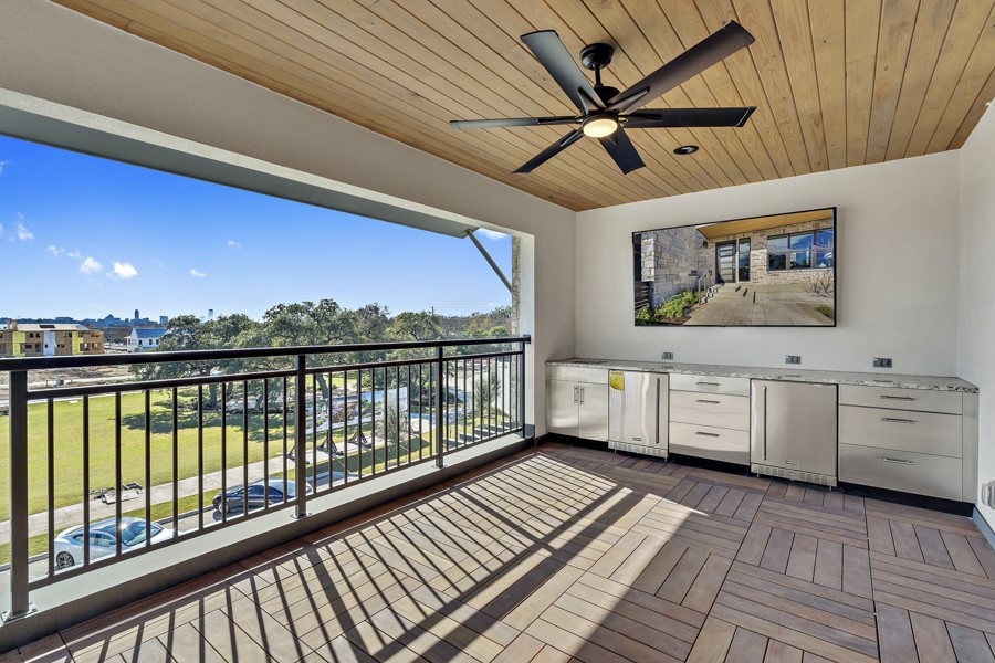 4206 Endurance Way Austin, TX 78731 - Photo 25 of 28 a view of a large room with furniture and a ceiling fan