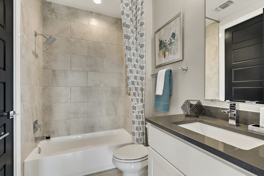 4206 Endurance Way Austin, TX 78731 - Photo 28 of 28 a bathroom with a sink a toilet and a bathtub