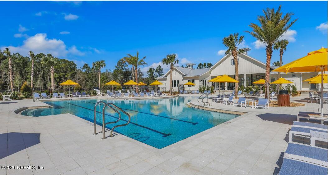 135 Sapling Terrace St. Johns, FL 32259 - Photo 14 of 17 a view of swimming pool with outdoor seating and city view