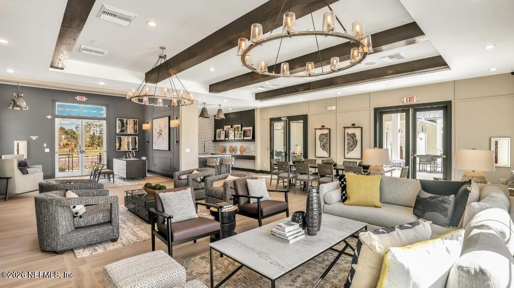 135 Sapling Terrace St. Johns, FL 32259 - Photo 16 of 17 a very nice looking living room with furniture and a chandelier