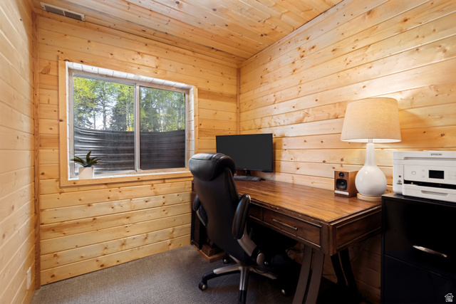 11237 East Aspen Road, Unit 74 Heber City, UT 84032 - Photo 22 of 32 Room featuring wood-finish paneling on walls and ceiling, a window with exterior tree scenery, and gray carpet flooring