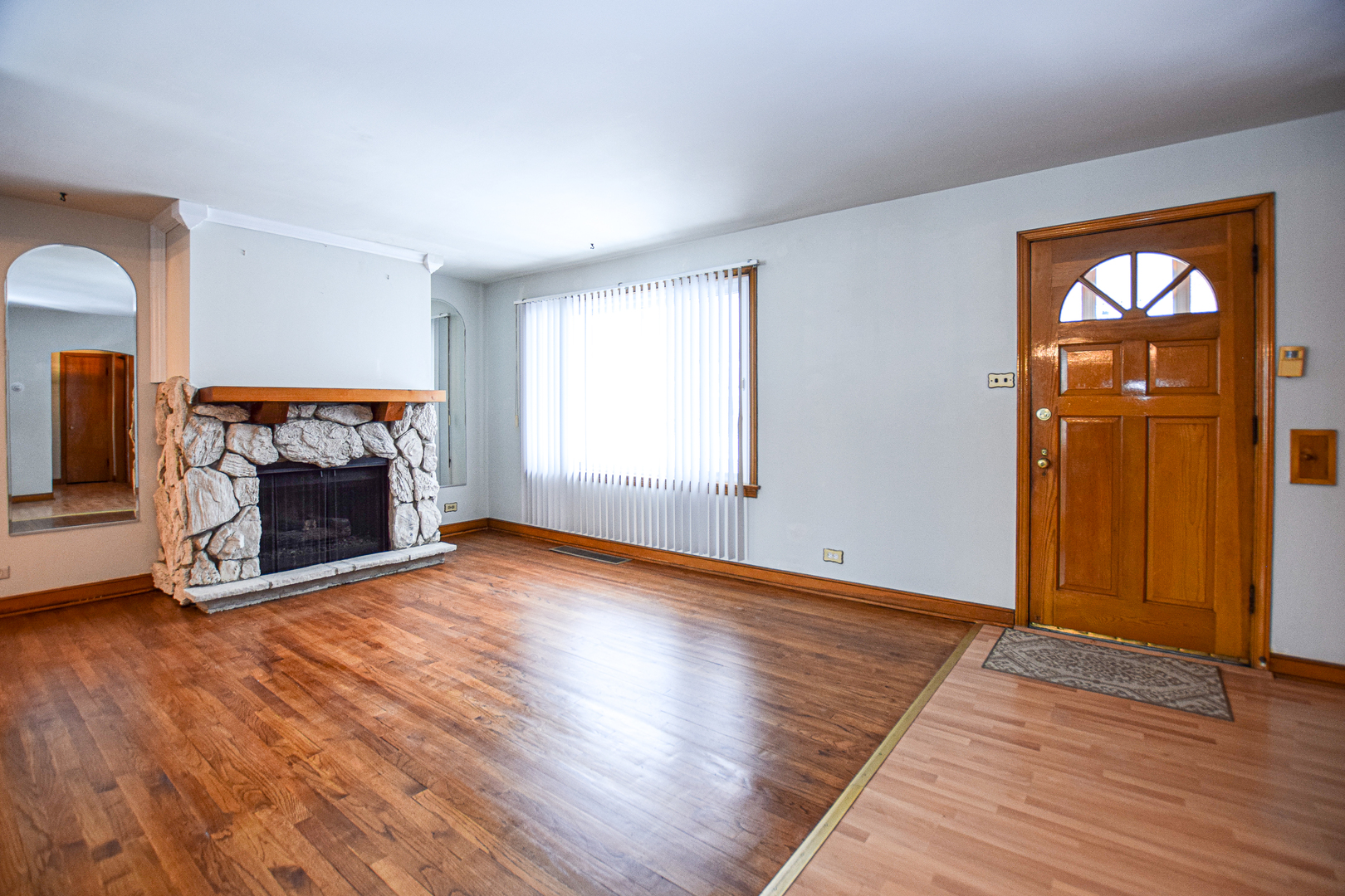 2513 South 4th Avenue North Riverside, IL 60546 - Photo 4 of 27 an empty room with wooden floor fireplace and windows