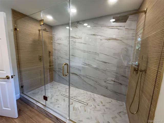 a bathroom with a shower and toilet