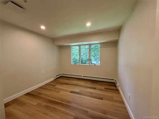 a bathroom with a toilet a sink a vanity and mirror