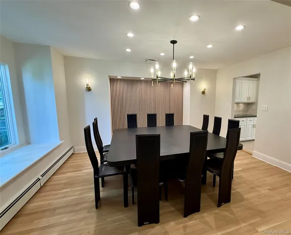 a large kitchen with a table and chairs