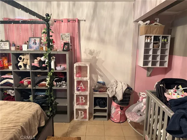 a bedroom with a bed and closet