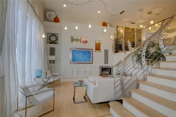a living room with furniture and a glass door
