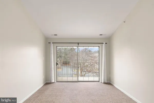 a view of a room with large windows