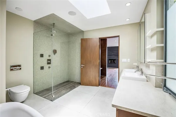a spacious bathroom with a shower and a toilet