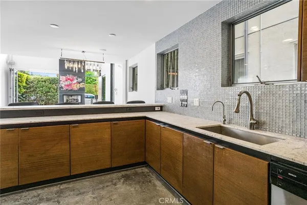 a bathroom with a sink and mirror