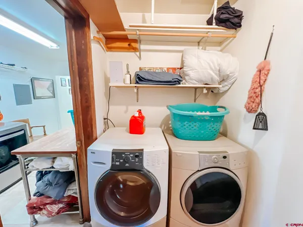 a room with lots of different colored cloths