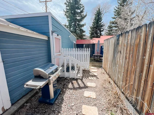 a view of a deck with wooden floor and chair